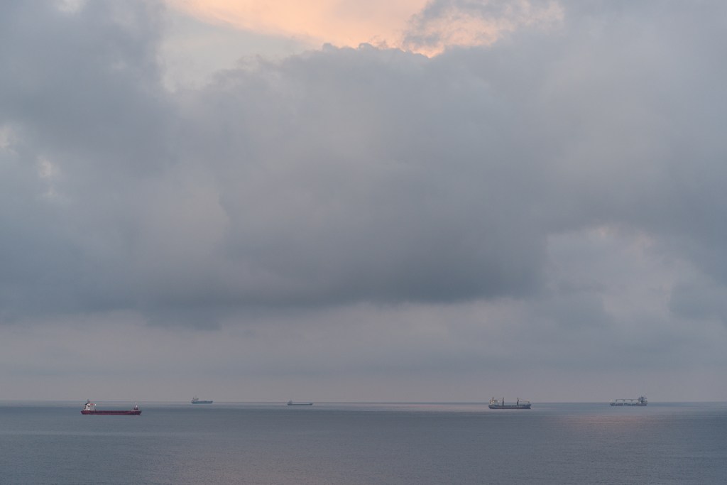 Ships at anchor in morning twilight - Livorno, Italy - August 16, 2020
